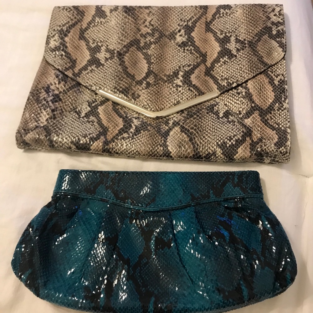 Two snake print clutch bag